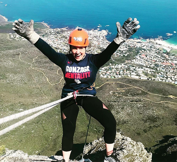 alum marissa clark hangs off high ledge in south africa