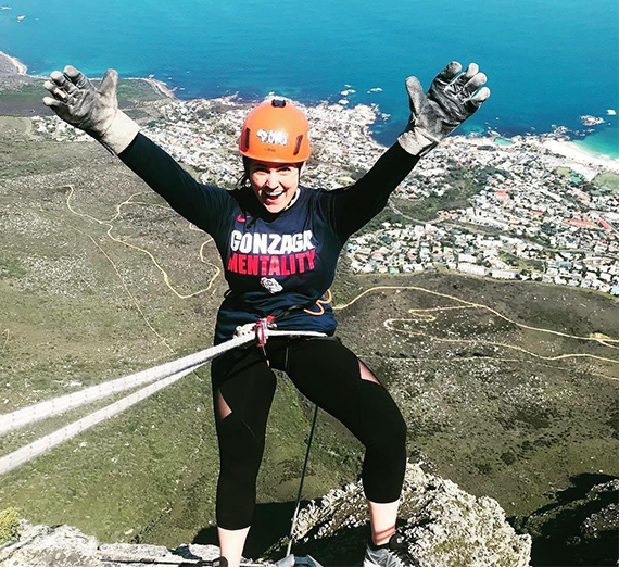 alum marissa clark hangs off high ledge in south africa 