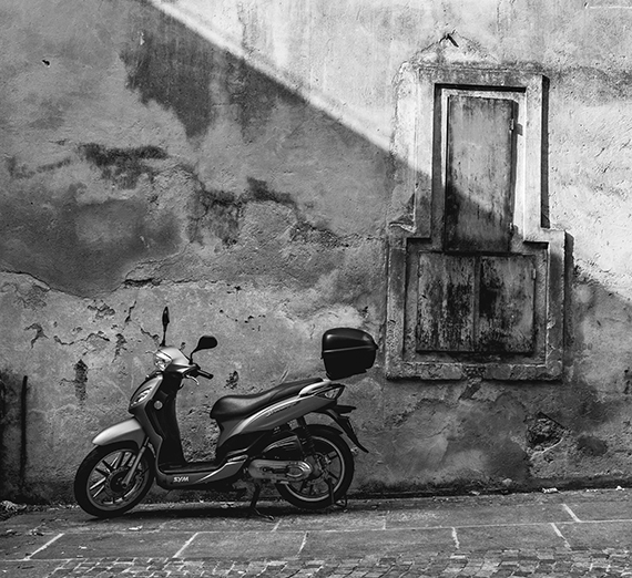 black and white image of motorbike in Italy