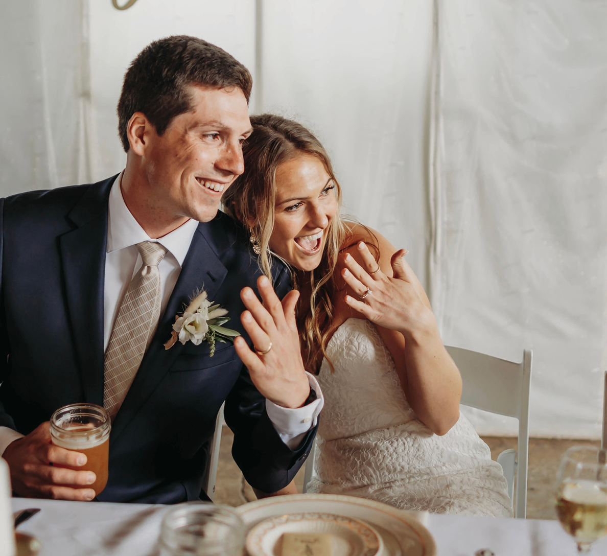 wedding couple shows off rings