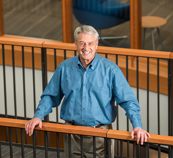 man stands on landing inside Gonzaga's Hemmingson Center