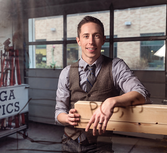 Josh Shultz with piece of wood