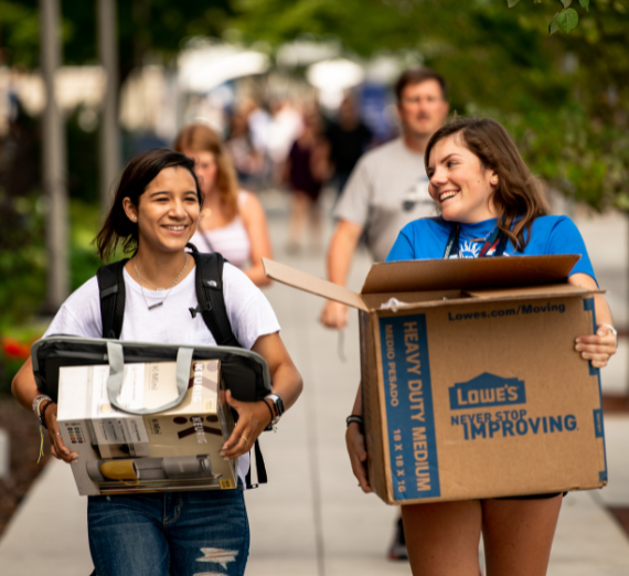 First-year students participate in the Welcome Walk during Orientation Weekend.