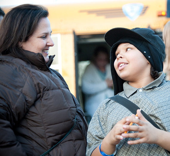 Sima Thorpe and a child in a service-learning program