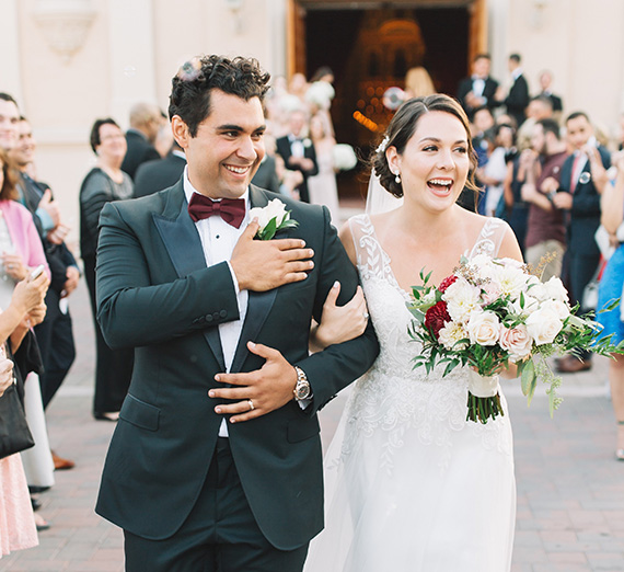 couple exits church wedding