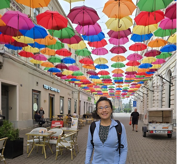 Ashley Davis in Romania with umbrellas