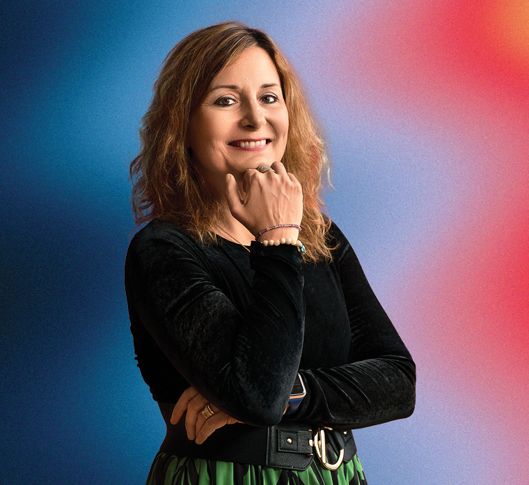 woman in black against colorful background