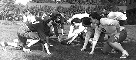 In 1951, the first-year women in beanies (left) competed against the sophomore women during Campus Days, in various events including pie eating, powder puff football, and tug of war. If the first-year class beat the sophomores, they could stop wearing their beanies for the rest of the year; otherwise they had to wear them through the end of October. (GU Archives)