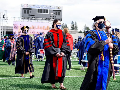 Faculty and administrators enter the stadium for one of the undergraduate ceremonies. (GU photo by Matt Repplier)
