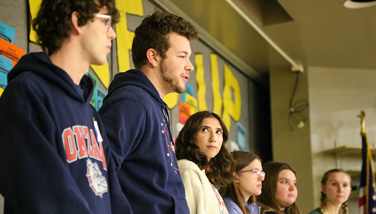 Gonzaga students speaking to elementary schoolers at a community partnership event.