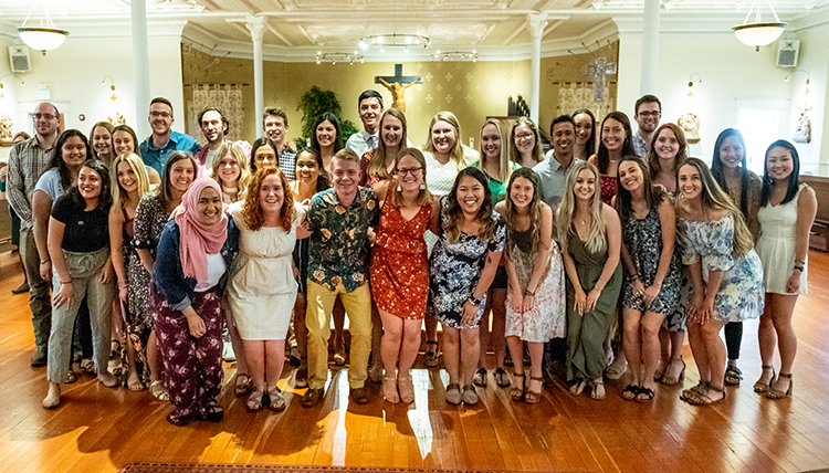 a group of 30 students in the chapel