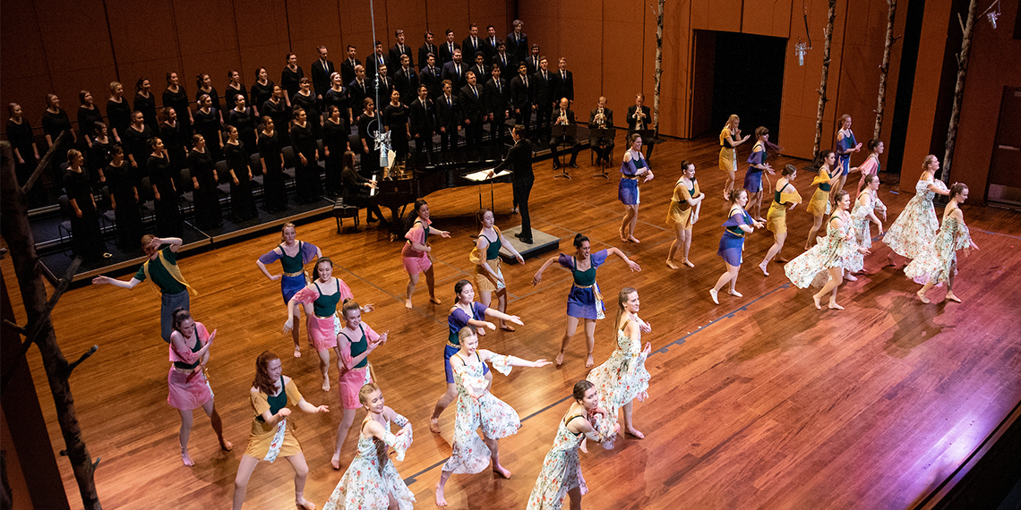 dancers and choral members on stage