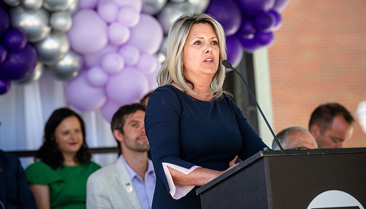 Spokane Mayor Nadine Woodward speaking at a podium