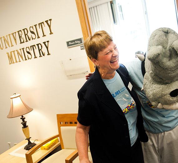 Sister Laura with Spike the bulldog mascot 