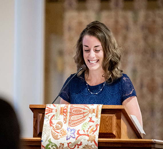 woman at chapel podium