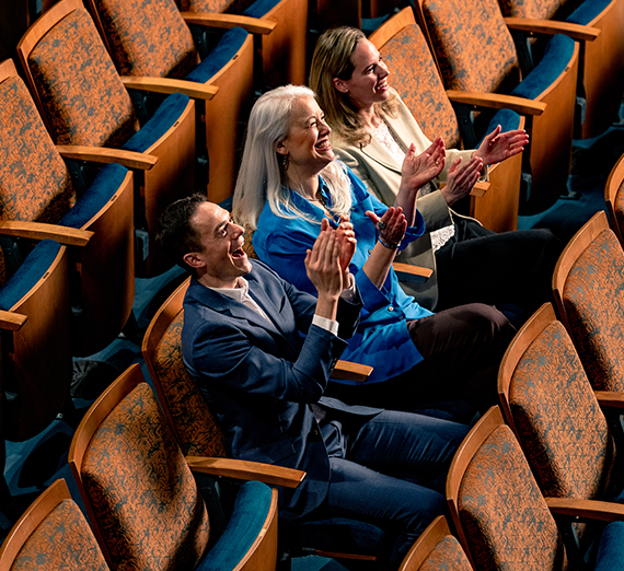 three directors sit in audience 