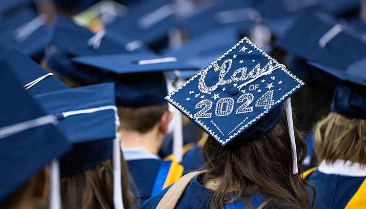 A graduation cap decorated with the words Class of 2024