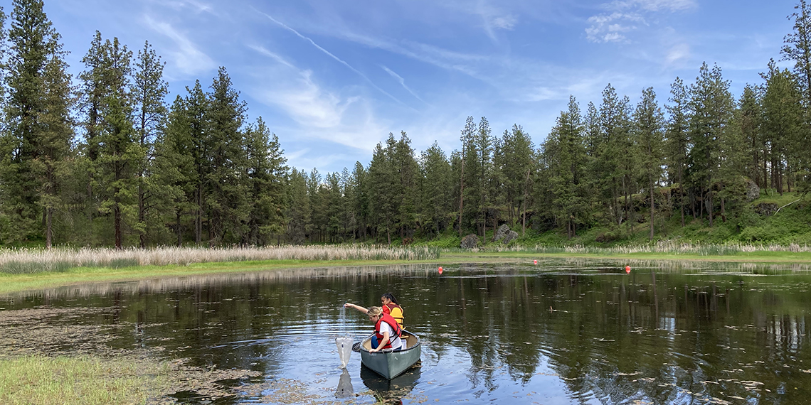 Students in a canoe on a Northwest lake. 
