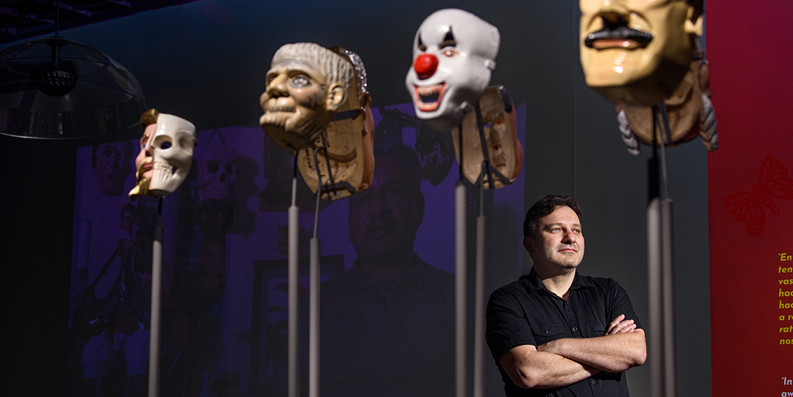 Pavel Shlossberg and some of the Mexican masks on display at the Northwest Museum of Arts and Culture