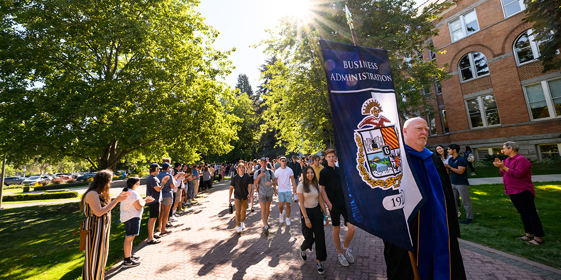 First-year students participate in the Welcome Walk during Orientation Weekend.
