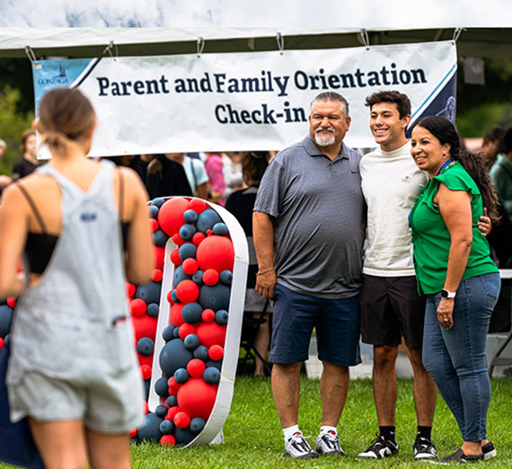 A family poses for a photo together on Move-in Day 