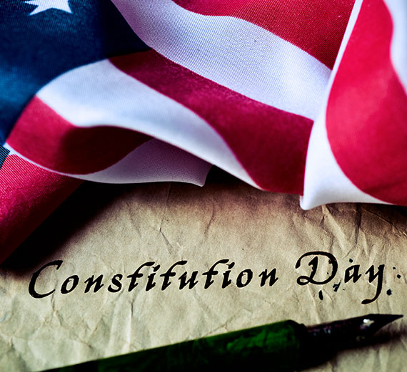 An American flag with the words Constitution Day