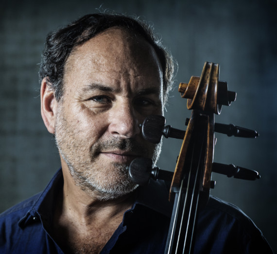 Close up image of Gary Hoffman holding a cello