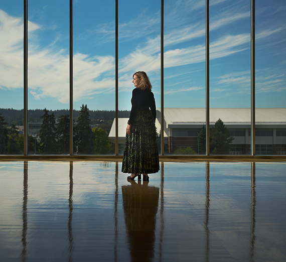 President Katia Passerini stands in front of windows in Hemmingson Center