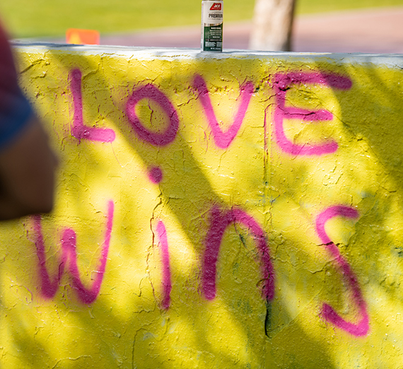 The words Love Wins spraypainted on a wall 