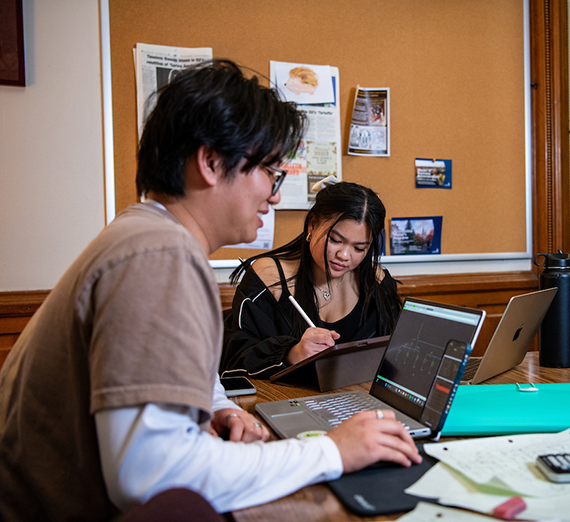 A man and woman studying together