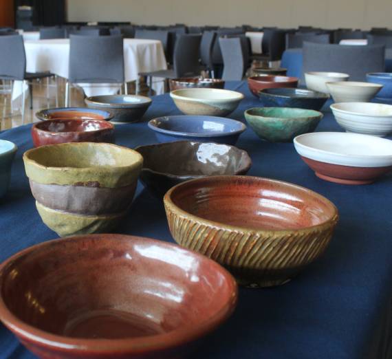 Collection of hand made bowls on a table.
