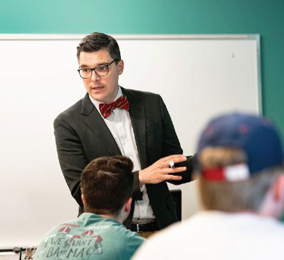 Associate professor Andrew Brajcich n the classroom.