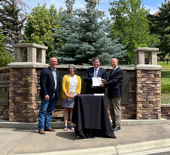 Gonzaga University and Carroll College team members announcing a partnership.