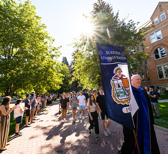 First-year students participate in the Welcome Walk during Orientation Weekend. 
