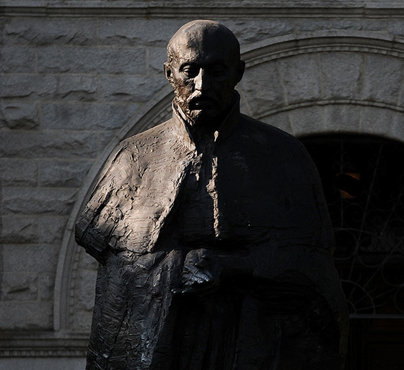 The statue of Saint Ignatius shadowed in the morning light 