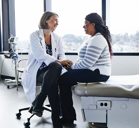 a woman doctor with a woman patient