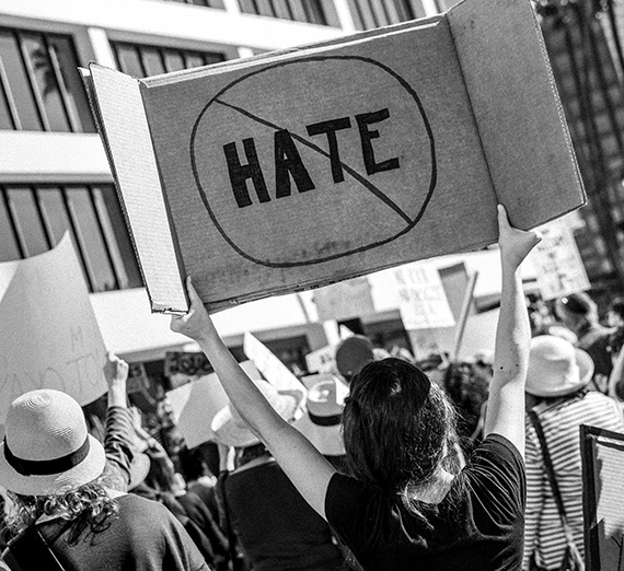 A woman declares “No Hate” at a protest in Los Angeles, California 2017. (Photo courtesy T. Chick McClure)