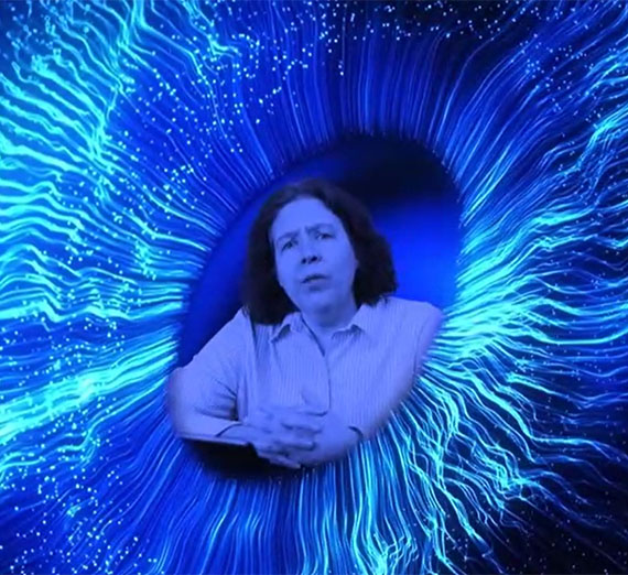 Dr. Tracey Hayes pictured in an abstract blue vortex meant to symbolize an eyeball. 