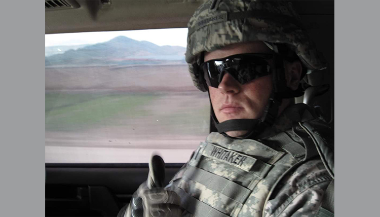 Whitaker in combat fatigues