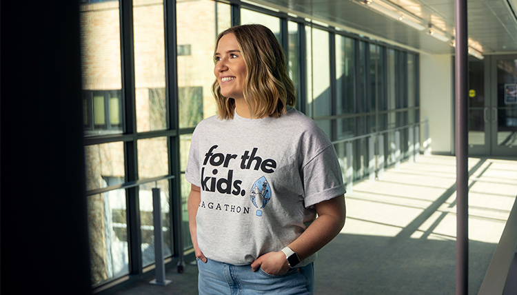 young woman in tshirt that says for the kids