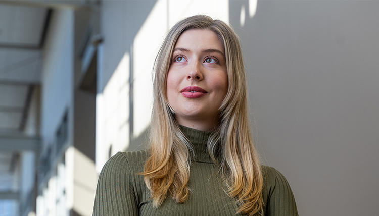 young woman in sweater with long hair