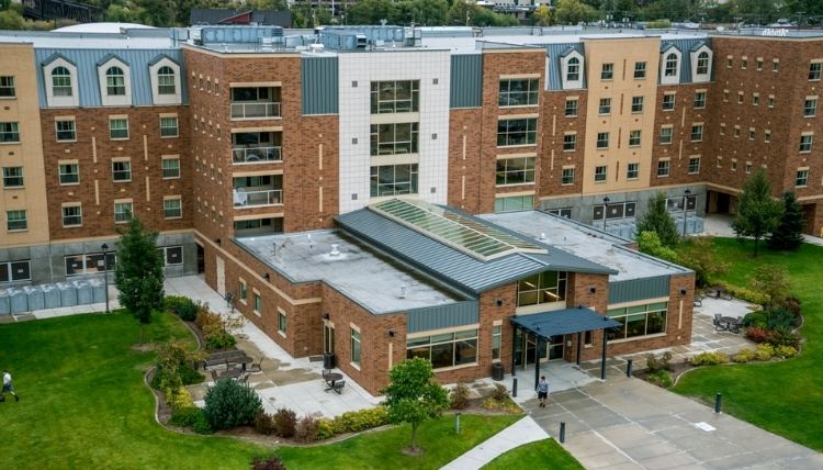 A photo of the front of Coughlin Hall, shot from a drone.