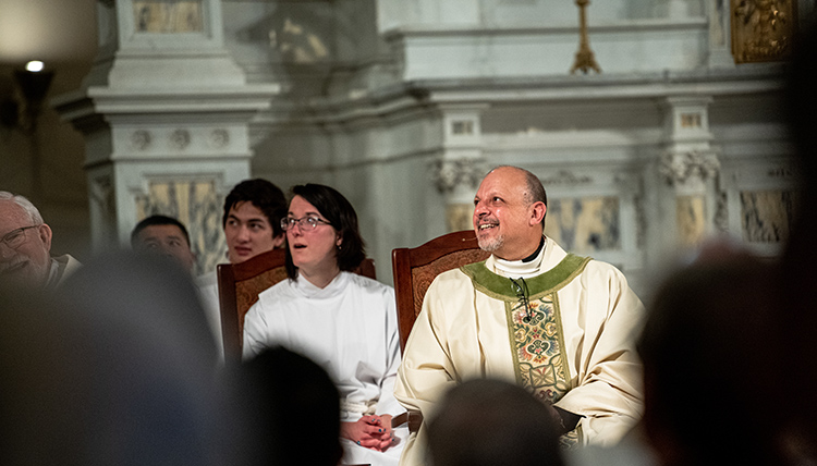 Jesuits in attendance celebrate a joyful moment.