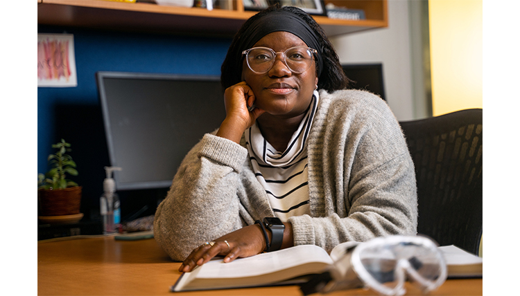 Fese poses at her desk in her office