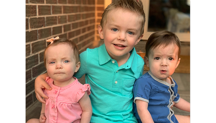 preschool brother with toddler twin siblings