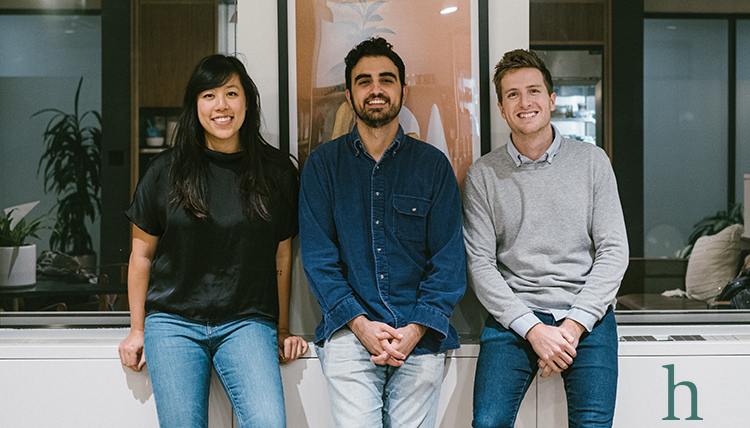 three young adults in office setting