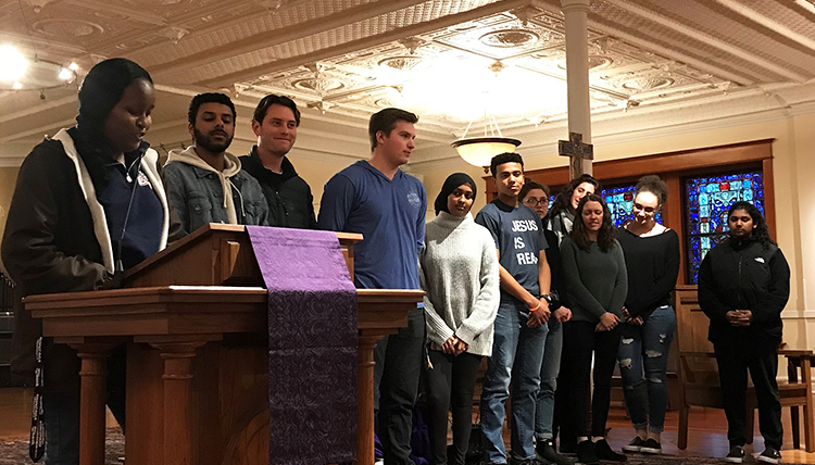 group of a dozen students in the student chapel