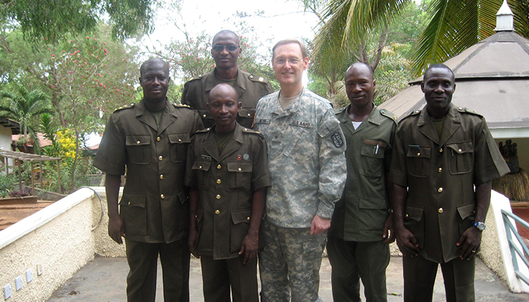 Jack Nevin with Malawi Soldiers