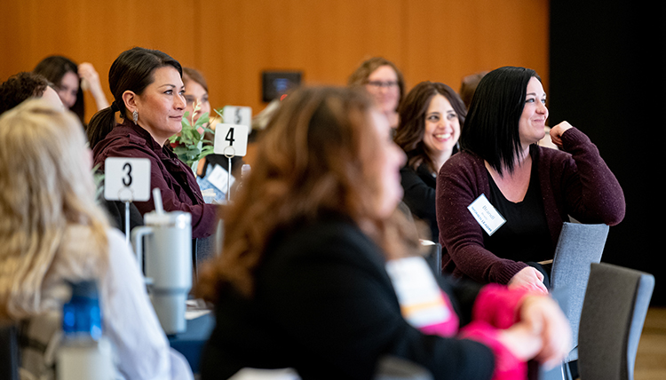 women listen to speaker