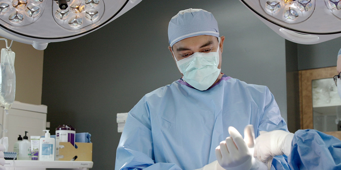 "Dr. Khalid Shirzad prepares for a surgery"
